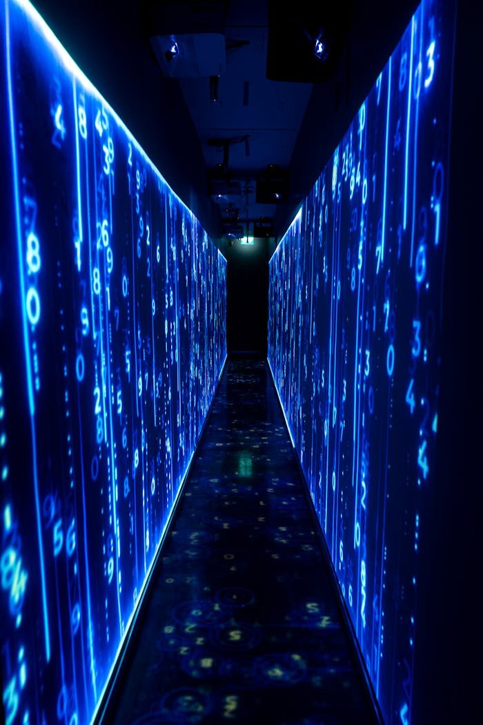 A luminous blue tunnel with digital numbers creating a futuristic, sci-fi ambiance.